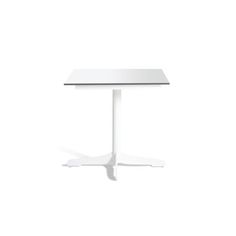 a white table sitting on top of a white floor