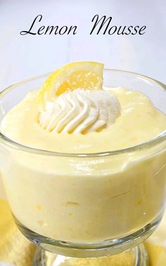 a lemon mousse in a glass bowl on a table