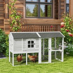 a chicken coop with two chickens in it