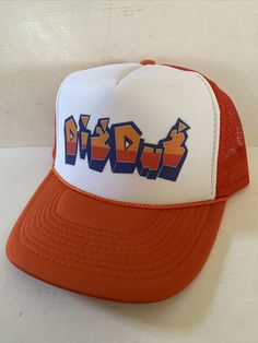 an orange and white trucker hat with the word ridd in blue letters on it