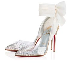 Christian Louboutin high heeled white and silver shoes with bow ankle wrap.  He is one of Frances finest luxury brands.  Se  the best in wine, jewelry and clothes that Paris can give.   luxurybrands #luxurylifestyle #France #Paris #shopping #wine #dotluxury #jewelry #shoes #Louboutin Wedding Shoes Bow, Heels Christian Louboutin, Wedding Shoes Flats