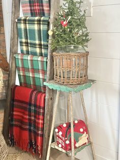 an old ladder is used as a christmas tree stand