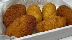 several fried food items in a white container