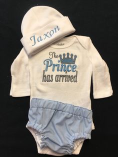 "This sweet outfit is perfect for a Baby Boys Coming Home Outfit or newborn pictures. The listing includes a Bodysuit or Gown with the words The Prince Has Arrived. You can add a Monogrammed Baby Beanie. And/or a Diaper Cover and/or White Monogrammed Socks **i primarily use Carter brand Just For You bodysuits that come in whole number sizes but if you prefer the Carter brand Child of Mine that comes in a different sizing number (ex. 0-3, 3-6) just let me know. Let me know if you want the option Customizable Fitted Sets For Baptism, Baby Boy Monogram Ideas, Baby Gown With Name, Personalized Onesie Boy, Personalized Fitted Onesie For Baptism, Personalized Newborn Outfit, Custom Baby Gifts Baby Boy Vinyl On Framw, Baby Boy Clothing Sets, Tutu Outfits