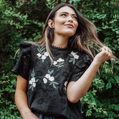 New Without Tags, Comes In Original Packaging. Embroidered Eyelet Black Blouse With Ruffle Shoulders And Lace Neck Trim. 100% Cotton Model Is 5'2”, Wearing Size Small. Chic Embroidered Lace Top For Spring, Chic Black Tops With Floral Embroidery, Black Embroidered Top For Spring, Floral Embroidery Tops For Spring Day Out, Spring Floral Embroidery Tops For Day Out, Spring Crew Neck Blouse With Floral Embroidery, Black Feminine Cotton Tops, Black Short Sleeve Top With Floral Embroidery, Black Floral Embroidered Short Sleeve Top