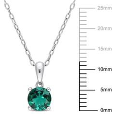 This glazing solitaire created emerald pendant captivates the stunning vibe that a diva requires. Crafted in sterling silver it showcases a round-cut, created emerald gemstone as the center stone in a 4 prong setting for a bold and stylish look. With a high polished finish, this pendant is suspended from an 18-inch round cable chain. Coordinate this versatile necklace with any ensemble from business casual to everyday wear. | Belk & Co Lab Created Created Emerald Solitaire Classic Basket Setting Formal Round Emerald Necklaces, Fine Jewelry Necklace With May Birthstone, Green Necklace With Prong Setting, Silver Sterling Silver Emerald Necklace, Sterling Silver Solitaire Necklace, Formal Sterling Silver Round Birthstone Necklace, Formal Round Gemstone Solitaire Necklace, Fine Jewelry May Birthstone Round Cut Necklace, May Birthstone Round Cut Fine Jewelry Necklaces