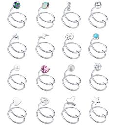 a bunch of different types of earrings on a white background