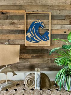 a wooden wall with a blue wave cutout on the side and a lamp next to it