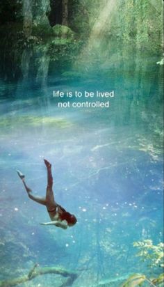 a person floating in the water with a quote above it that says life is to be lived not controlled