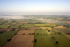 an aerial view of the countryside and fields