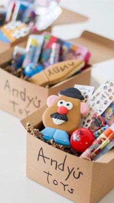 two cardboard boxes filled with assorted items on top of a white table and the words ideas sorpresas en cautas