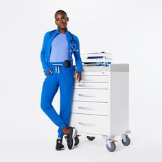 Official FIGS® Scrubs. Ridiculously Soft Scrubs Designed Just For You. Get Free Shipping On Orders $50+! | FIGS Womens Royal Blue High Waisted Uman Relaxed - Jogger Scrub Pants Vest Layering, Figs Scrubs, Lab Coats, Mens Home, Scrub Pants, Scrub Tops, Anti Wrinkle, Black And Navy, Outerwear Jackets