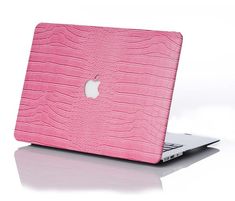 a pink macbook air case with an apple logo on it