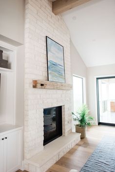 a white brick fireplace in a living room