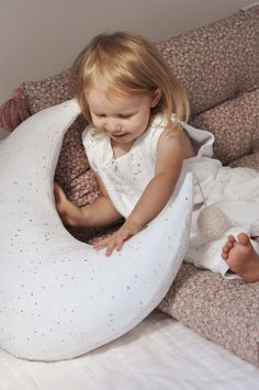 Lilymer moon shaped nursing Pillow is not only a useful accessory while breast feeding but also an adorable addition to your interiors. It is equipped with a zippered cover to be easy removable and washable, it is ergonomically designed to fit the natural contours of a woman's body to relieve the nursing and feeding discomfort, and it is also cute decoration in neutral colors fitting every interior. The pillowcase is made of soft and delicate muslin, cotton fabric comforting to baby skin, filled Baby Nursing Pillow, Organic Cotton Pillows, Feeding Pillow, Moon Pillow, Baby Pillow, Natural Contour, Breast Feeding, Nursing Pillow, Baby Pillows