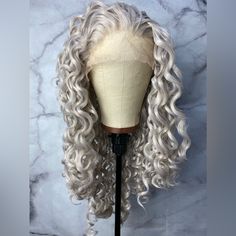 Hair Length: 24 Inches Hair Style: Long Curly Hair Color: Silver Grey Hair Density: 150% -180% Hair Material: 100% High Quality Heat Resistant Synthetic Hair Cap Size: Medium Net Size, Average 22.75” Silver Gray Human Hair Wigs, Long Curly Hair Color, Style Long Curly Hair, Grey Lace Front Wig, Hair Color Silver, Silver Wig, Curly Hair Color, Gray Wig, Blonde Weave