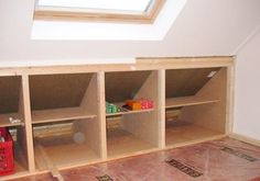 a room with some shelves in it and a skylight