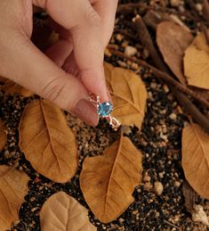 Design by ManhattanBox ITEM DESCRIPTION ✦Teal Sapphire engagement ring ✦Available in yellow, white or rose solid 14 or 18k gold. ✦Band width approx 1.2mm ✦Band thickness approx 1.2mm Center Stone: Natural Teal Sapphire Shape: Oval Size: 6*8mm Accent Stone: Diamond Shape: Round Carat: 0.06ct Total Weight: about 2.52g A leaf-shaped and hollowed-out prong setting liberates the glowing of the gemstone from every angle, and a ring band in the shape of branches with leaves dotted with side accents mak Rose Gold Sapphire Ring With Diamond, Gift, Couple Rings Open Ring With Prong Setting, Rose Gold Fine Jewelry Couple Rings As Gift, Rose Gold Fine Jewelry Couple Rings, Rose Gold Couple Rings For Gifts, Rose Gold Crystal Ring With Prong Setting As Gift, Topaz Open Ring Jewelry Gift, Gift Rose Gold Birthstone Ring With Prong Setting, Open Ring Topaz Wedding Jewelry