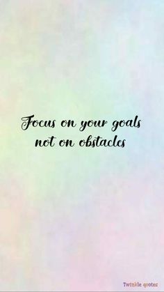 the words focus on your goals, not on obstacles are written in black ink against a pastel background