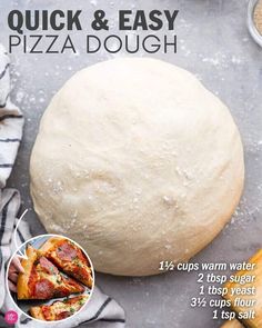 a pizza dough sitting on top of a table next to other food and bread items