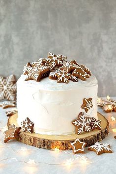 there is a white cake with icing and snowflakes on it