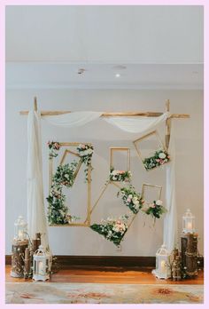 the wedding arch is decorated with flowers and greenery