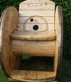 a wooden wagon with wheels made to look like an animal