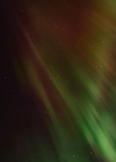 the aurora bore is shining brightly in the night sky