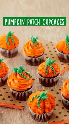 there are many cupcakes with orange frosting on them