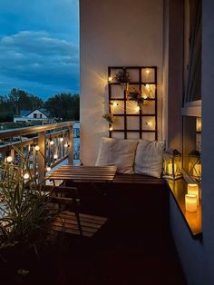 the balcony is decorated with candles and lights