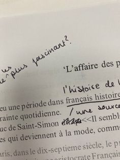 a piece of paper with writing on it and some type of text written in french