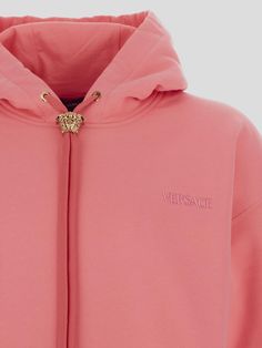 Versace hoodie made of pure brushed cotton jersey with metal Medusa element on drawstring. Kangaroo pocket, ribbed hems, finished with tone-on-tone lettering logo embroidered at chest. Loose fit.Gender: MENMaterial: 100% COTTONColor: PINKMade in: ITProduct ID: 1008661 1A06213 1PN50*Import tax/duty will be calculated at checkout (If applicable) Pink Cotton Hoodie With Logo Detail, Luxury Cotton Hoodie Sweatshirt, Pink Hoodie With Logo For Winter, Casual Pink Hoodie With Logo Detail, Pink Winter Hoodie With Logo Detail, Pink Winter Hoodie With Logo, Luxury Sweatshirt With Drawstring Hood, Luxury Cotton Hoodie With Ribbed Cuffs, Luxury Hooded Sweatshirt With Ribbed Cuffs