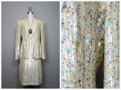 "This is a RARE and AMAZING vintage dress suit! Both pieces are beautifully detailed with sequins all over and accented with beading along the hems. It's in PERFECT condition! Note, measurements are taken with the front brought together, there are no closures on the blazer. Bust - 36/38\" Shoulders - 16\" Sleeves - 24.5\" Length of Jacket - 26\" Skirt Waist - 27\" Hips - 38\" Length of Skirt - 23\" Tag Size - 4 This item comes from a pet-free and smoke-free home. If you would like more info or h Glamorous Sequin Sets For Celebrations, Glamorous Sequined Sets For Celebration, Glamorous Sequined Celebration Sets, Spring Embellished Party Sets, Spring Party Embellished Sets, Glamorous Sequined Sets For Formal Occasions, Glamorous Formal Sequined Sets, Glamorous Formal Sets With Sequins, Glamorous Fitted Silk Set