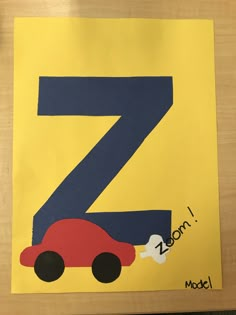 a child's handmade letter z is shown with a car on the front