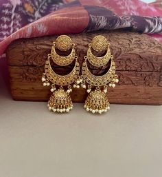 Feel glamorous in these beautiful lightweight gold chandbalis with jhumka! Lovely and unique, next to real look is perfect for any wedding.  Details: Length-3 Inches Weight of Each Earring-15.5 gms All products are manufactured using traditional skills from our rich heritage of crafts.  The process of these crafts is essentially manual. Hence, any irregularities or variations are an inherent part of these handcrafting processes. Bridal Jhumka, Wedding Jewelry Indian, Gold Jhumka, Gold Jhumka Earrings, Bollywood Jewelry, Indian Wedding Jewelry, Jewelry Indian, Jhumka Earrings, Earrings Wedding