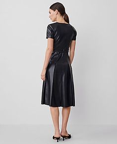 Elevate your wardrobe with the Ann Taylor Faux Leather Pleated Midi Dress, a perfect blend of sophistication and modern flair. This dress is designed to impress with its luxurious faux leather and elegantly pleated skirt that adds a touch of feminine edge.

- Size: Regular - 4
- Color: Black
- Gender: Female
- Material: Shell - 100% Polyester with Polyurethane Coating; Lining - 100% Polyester
- Features: Crew neck, short sleeves with back raglan seams, self-tie buckle belt, hidden back zipper wi Leather Midi Dress, Pleated Midi Dress, Sleepwear & Loungewear, Sleeve Dresses, Buckle Belt, Petite Fashion, Petite Dresses, Black Midi Dress, Polished Look