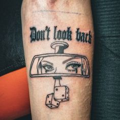 a tattoo with the words don't look back on it