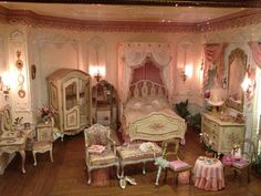 a doll house bedroom with furniture and accessories