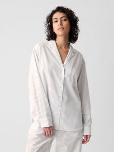 Soft poplin pajama shirt.  Notch collar.  Long sleeves with button cuffs.  Button front.  Patch pocket at chest.  Certain styles have allover prints.  Straight silhouette with a relaxed fit.  Hits at the hip.  Models wearing Gap Dungaree Jeans, Notch Collar, Boys Coat, Loungewear Shorts, Pajama Shirt, Set Outfit, Workwear Dress, Blouse And Skirt, Gray Jacket