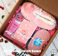 a pink gift box filled with lots of different items