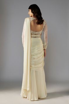 Ivory pre-draped saree in a solid base. Comes with padded blouse embellished by sequin bead floral vine patterns and belt. - Aza Fashions Elegant Cream Pre-draped Saree For Wedding, Elegant Off-white Georgette Pre-draped Saree, Silk Blouse Piece With Draped Sleeves For Wedding, Elegant Cream Pre-draped Saree With Sheer Dupatta, Elegant Cream Georgette Pre-draped Saree, Elegant Off-white Pre-draped Saree With Sheer Dupatta, Elegant White Draped Saree, Elegant Draped Wedding Saree, Saree Gowns