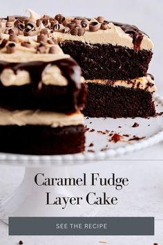 a close up of a cake on a plate with the words caramel fudge layer cake