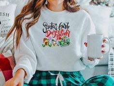 "Santa's Favorite Daycare Provider 🎄 Get ready for the holidays in one of our adorable daycare tees or sweatshirts! Makes for a wonderful gift for the daycare provider in your life! Shop MORE Christmas Shirts/Sweatshirts here: https://etsy.me/2FrfJqO * * * * * * * * * * * * * * * * * * * * * * * * * * * * * ♥️ LISTING 1 - Santa's Favorite Daycare Provider Shirt or Sweatshirt HOW TO ORDER: * Choose size. (Unisex T-Shirt or Crewneck Sweatshirt) * Select Color if available. * Enter personalization Vet Tech Shirt, School Custodian, Coach Shirt, School Secretary, Daycare Providers, Surgical Tech, Lab Tech, Tech Shirt, Sharp Objects