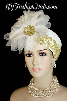 Women's White Pillbox Fashion Designer Haute Couture Hat Trimmed With A Large White Crinoline Horse Hair Bow, Enhanced With Expensive White Rooster Feathers. Metallic Gold Embroidered Flower Appliques Are Placed Around The Crown Of This Fashion Hat, As Well As Placed In The Center Of The Feathers. This Formal Hat Can Be Worn In Different Positions. This ladies hat is appropriate to wear for the Kentucky Derby, Melbourne Cup, Royal Ascot, horse races, Saratoga racing, Church, weddings, and specia Gatsby Style Hat For Vintage Events, Vintage Wedding Costume Hat With Pinched Crown, Vintage Gatsby Style Hat Headpiece, Vintage Wedding Hat With Pinched Crown, Gatsby Style Wedding Fascinator With Short Brim, Vintage Headpieces For Wedding And Kentucky Derby, Vintage Wedding Headpiece For Kentucky Derby, Adjustable Vintage Fascinator For Wedding, White Hat For Vintage Events