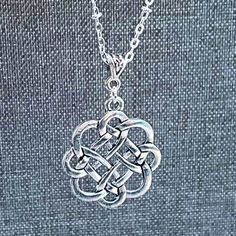 This beautiful Dara Celtic Knot pendant is a perfect way to pay tribute to your heritage. The design features a Celtic Dara Knot that is a symbol of intertwined lines that have no beginning or end.  The Dara Knot (sometimes referred to as the Shield Knot) is one of the most popular Celtic symbols. It's one of several Celtic symbols for strength and it symbolizes a strength drawn from unity. ~ Dara Celtic Knot Pendant ~ Celtic Knot Bail ~ Silver Plate Satellite Chain (choose your length in drop d Spiritual Silver Necklaces For Friendship, Silver Round Pendant Necklace For Friendship, Elegant Silver Necklace For Friendship, Elegant Friendship Necklaces, Symbols For Strength, Celtic Dara Knot, Dara Celtic Knot, Shield Knot, Celtic Knot Wedding