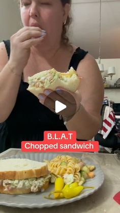 a woman eating a sandwich and pasta salad on a plate with the caption b l a t chopped sandwhich