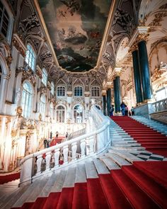 an ornate building with red carpet and stairs