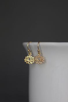 "Sweet 24k gold vermeil Lotus Flower charms simply dangle from balled 18k gold vermeil earwires. These earrings are incredibly lightweight and wonderful to wear every day. Perfect for bridal party gifts. Lotus flower: 12x12mm (including the ring at the top) Total length of earrings: almost 1\" These earrings are also available in silver... www.etsy.com/listing/992085331/lotus-flower-earrings-silver As the owner, maker, designer, and curator of this shop, I take great pride in providing you with Flower Earrings Gold, Gold Filigree Earrings, Dangle Earrings Gold, Gold Lotus, Westlake Village, Silver Flower Earrings, Gold Dangle Earrings, Filigree Earrings, Gold Filigree