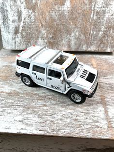 a toy truck is sitting on a wooden table