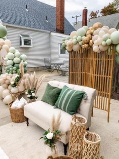 a living room filled with lots of furniture and balloons